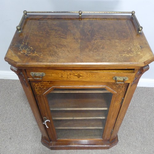 514 - A Victorian walnut inlaid music / display Cabinet, three quarter gallery over glazed door, raised on... 