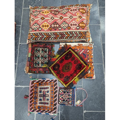 550 - Tribal Rugs: a large Kelim Cushion, 93cm x 65cm, together with four smaller tent bags, all in good c... 