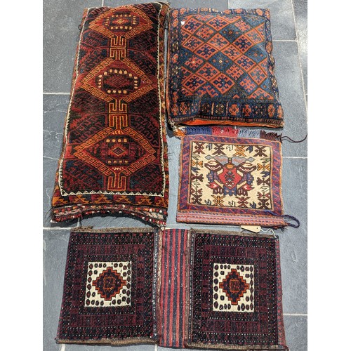 551 - Tribal Rugs: a Belouch Camel Bag, 107cm x 49cm, together with three smaller tent bags, all in good c... 