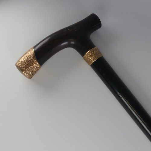 516 - A George V 9ct gold mounted walking Stick / Cane, hallmarked London 1926, with shaped coromandel han... 