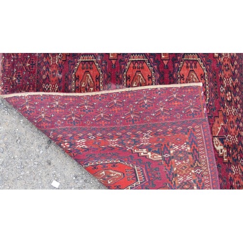 553 - Tribal Rugs: a Sumak red-ground Rug, 95cm x 120cm, good condition together with two Afghan rugs, 80c... 