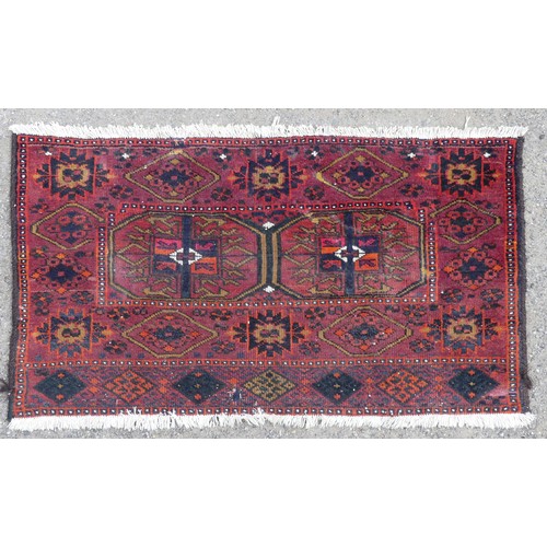 553 - Tribal Rugs: a Sumak red-ground Rug, 95cm x 120cm, good condition together with two Afghan rugs, 80c... 