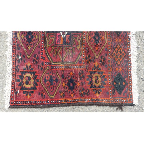 553 - Tribal Rugs: a Sumak red-ground Rug, 95cm x 120cm, good condition together with two Afghan rugs, 80c... 