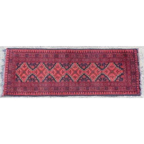 554 - Tribal Rugs: two small Afghan red-ground runners, both approx. 148cm x 52cm and in good condition (2... 