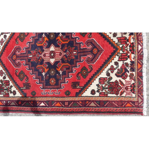 555 - Tribal Rugs: a Hamadan red-ground Rug, 147cm x 104cm, good condition, together with another similar,... 