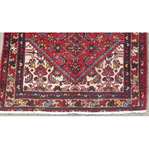 555 - Tribal Rugs: a Hamadan red-ground Rug, 147cm x 104cm, good condition, together with another similar,... 