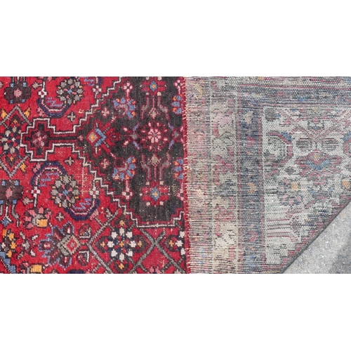 555 - Tribal Rugs: a Hamadan red-ground Rug, 147cm x 104cm, good condition, together with another similar,... 