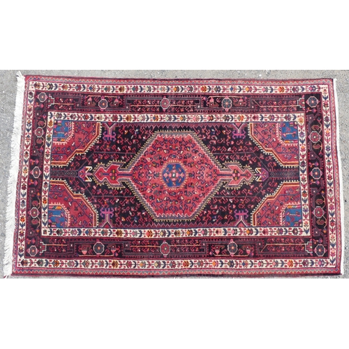 556 - Tribal Rugs; a Hamadan red-ground Rug, 171cm x 103cm, good condition.