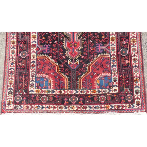 556 - Tribal Rugs; a Hamadan red-ground Rug, 171cm x 103cm, good condition.