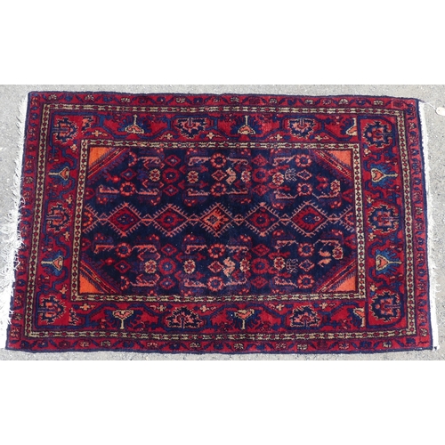 557 - Tribal Rugs; a Hamadan dark blue and red-ground Rug, 179cm x 112cm, fringes worn, pile in good condi... 