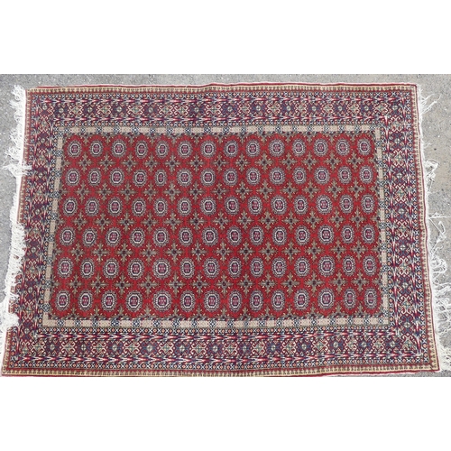 559 - Tribal Rugs; a good finely knotted Caucasian Bokhara design carpet, short wool pile on cotton base, ... 