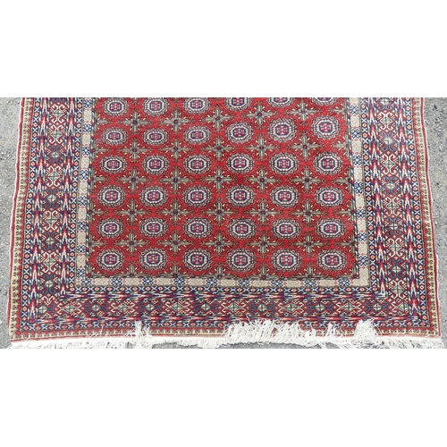 559 - Tribal Rugs; a good finely knotted Caucasian Bokhara design carpet, short wool pile on cotton base, ... 