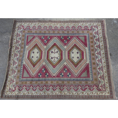 560 - Tribal Rugs; a hand-knotted Turkish pink and cream-ground Carpet, wool pile on wool base, 306cm x 23... 