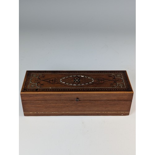 519 - A 20th century oak and mother of pearl inlaid Writing Set / Stationery Box, the case with decorative... 