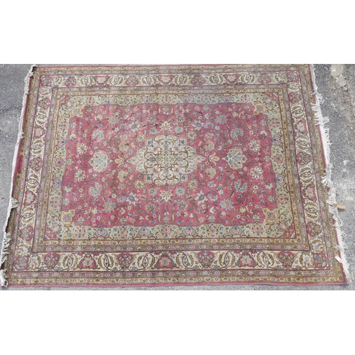 561 - Tribal rugs; a hand-knotted salmon-pink ground Persian carpet, wool pile on cotton base, with gold a... 