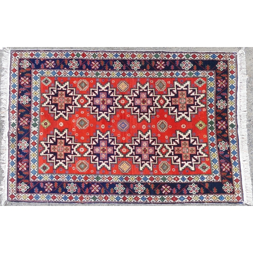 564 - Tribal rugs; a hand-knotted orange ground Kazak Rug, wool pile on cotton base, 193cm x 118cm, good c... 