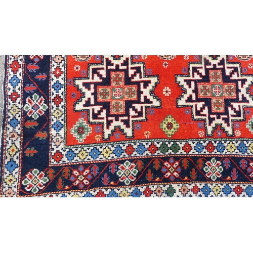 564 - Tribal rugs; a hand-knotted orange ground Kazak Rug, wool pile on cotton base, 193cm x 118cm, good c... 