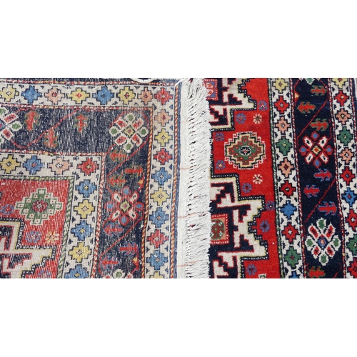 564 - Tribal rugs; a hand-knotted orange ground Kazak Rug, wool pile on cotton base, 193cm x 118cm, good c... 