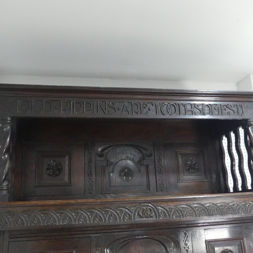 522 - An 18th century style Welsh oak Tridarn, circa 1930, moulded cornice with motto ''OLD PIPPINS ARE TO... 