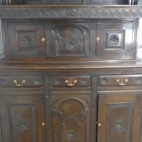 522 - An 18th century style Welsh oak Tridarn, circa 1930, moulded cornice with motto ''OLD PIPPINS ARE TO... 