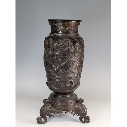 153 - A large Japanese Meiji Period bronze Vase (1868 - 1912), decorated in relief of stylised Peacocks an... 