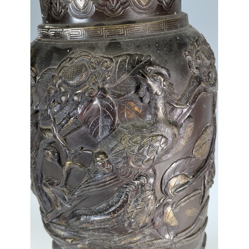 153 - A large Japanese Meiji Period bronze Vase (1868 - 1912), decorated in relief of stylised Peacocks an... 