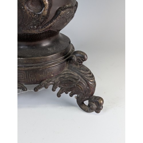 153 - A large Japanese Meiji Period bronze Vase (1868 - 1912), decorated in relief of stylised Peacocks an... 