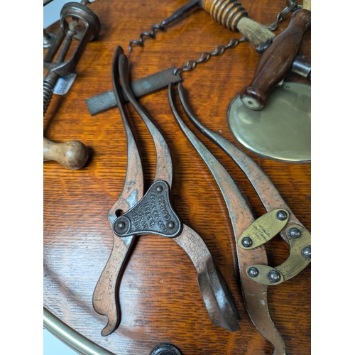 529 - A 19th century two-pillar mechanical Corkscrew, with turned handle, together with an Edwardian Brass... 