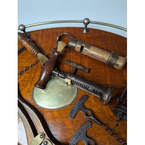 529 - A 19th century two-pillar mechanical Corkscrew, with turned handle, together with an Edwardian Brass... 