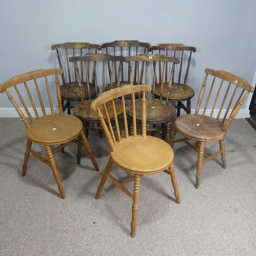 531 - A set of eight country house style rustic oak kitchen Chairs, stick backs over circular seats, raise... 