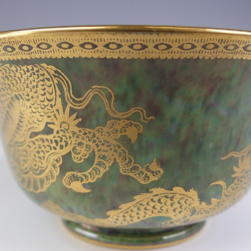 111 - Daisy Makeig-Jones for Wedgwood; a Fairyland Lustre Dragon Bowl, the interior in colours outlined in... 