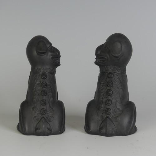 114 - A pair of Wedgwood black Basalt salt and pepper Shakers, in the form of Dogs of Foo, impressed marks... 