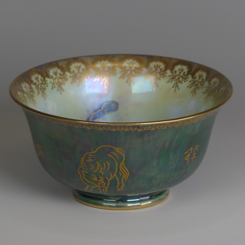 115 - Daisy Makeig-Jones for Wedgwood; a Fairyland Lustre Bowl, the exterior decorated in mottled green wi... 