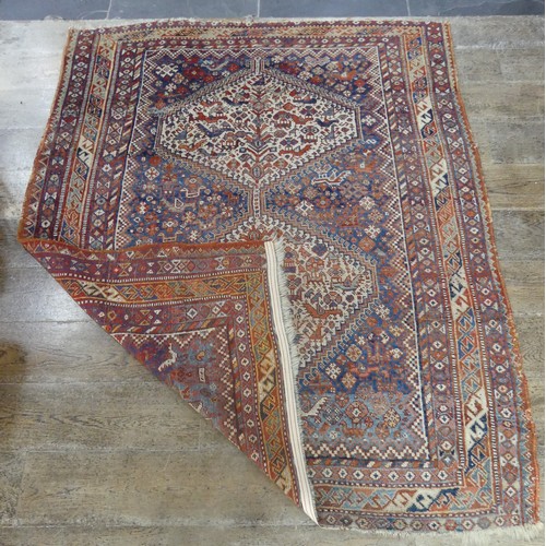 567 - Tribal Rugs; two old Caucasian rugs, 100% wool, one with stylised exotic birds, animals and flowers,... 