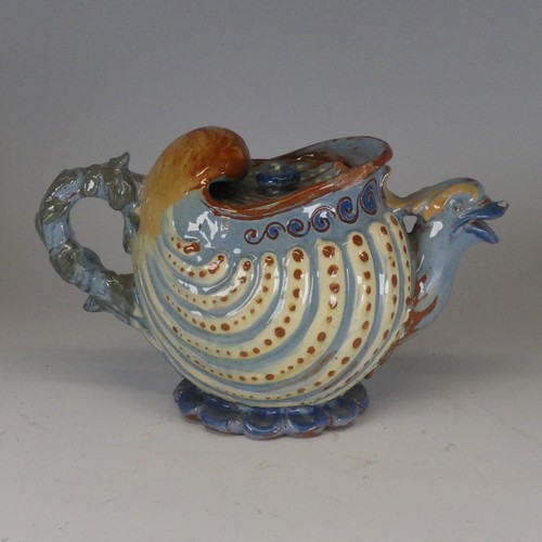 118 - A C H Brannam Barum pottery nautilus shape grotesque Teapot, with bird spout decorated in tones of b... 