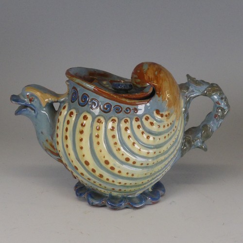 118 - A C H Brannam Barum pottery nautilus shape grotesque Teapot, with bird spout decorated in tones of b... 