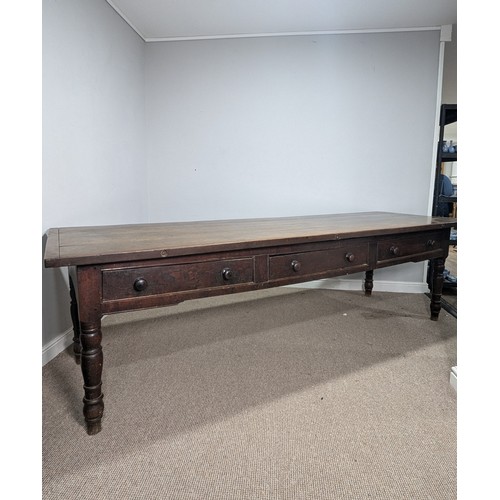 539 - A large 19th century farmhouse kitchen Table, four plank top with cleated ends, raised on later oak ... 