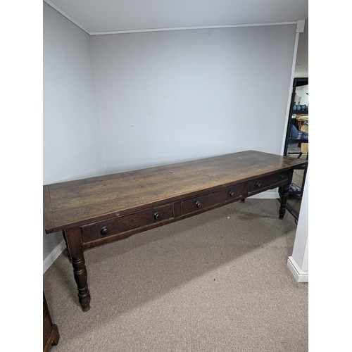 539 - A large 19th century farmhouse kitchen Table, four plank top with cleated ends, raised on later oak ... 