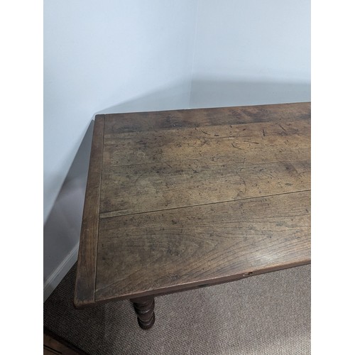 539 - A large 19th century farmhouse kitchen Table, four plank top with cleated ends, raised on later oak ... 