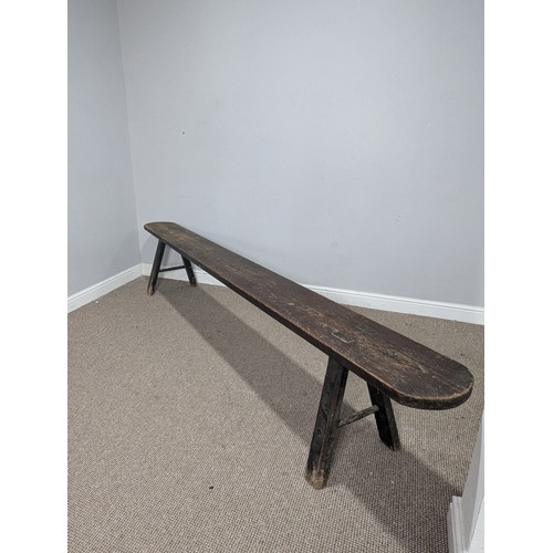 540 - A large 19th century pine joint Bench or Form, the rectangular top with rounded ends, raised on tres... 