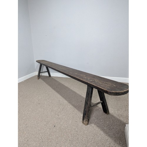 540 - A large 19th century pine joint Bench or Form, the rectangular top with rounded ends, raised on tres... 