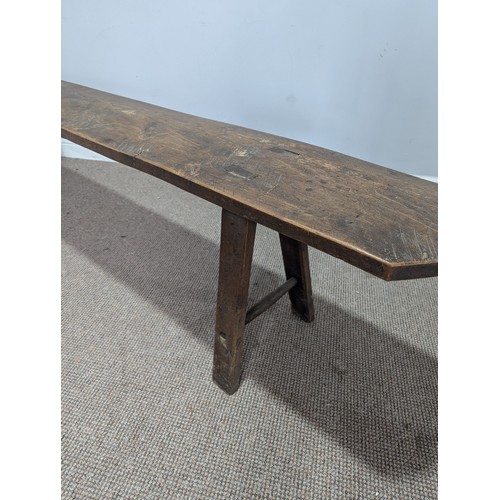 541 - A large 19th century elm joint Bench or Form, rectangular top on trestle type supports of tapering s... 