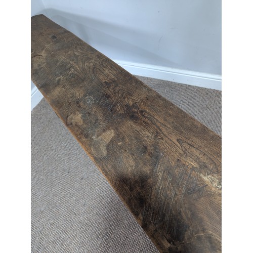 541 - A large 19th century elm joint Bench or Form, rectangular top on trestle type supports of tapering s... 