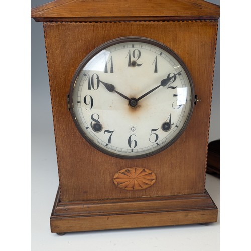 309 - An mahogany and inlaid mantle Clock, white circular dial with arabic numerals, case with decorative ... 