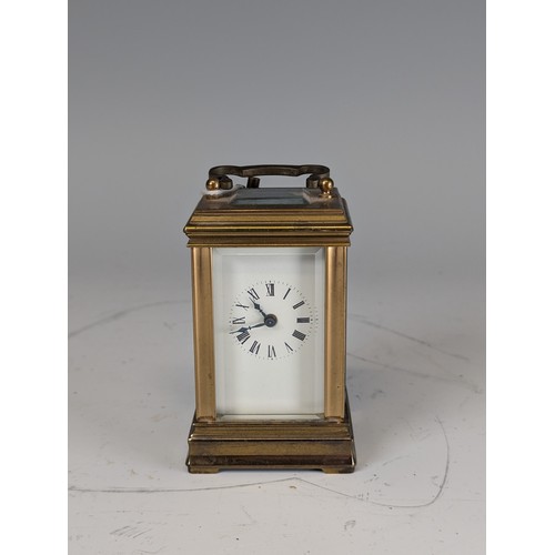 312 - An early 20th century French gilt brass miniature carriage Clock, movement stamped 'ACG' and '348', ... 