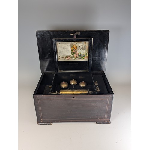 528 - A 19th century rosewood and marquetry musical Box, playing on eight airs and three bells, paper stam... 