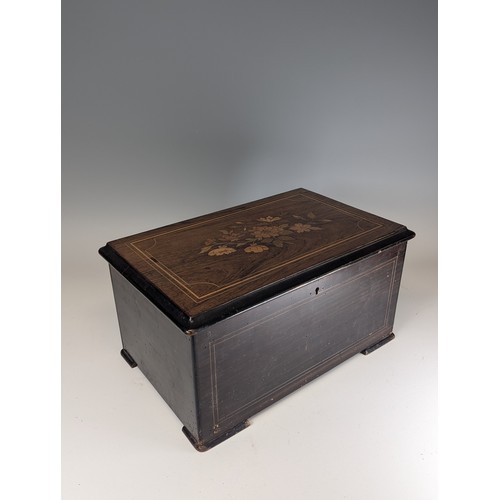 528 - A 19th century rosewood and marquetry musical Box, playing on eight airs and three bells, paper stam... 