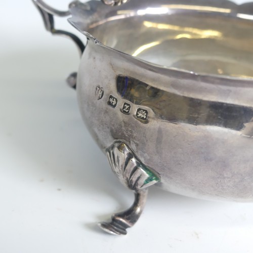 22 - A Victorian silver Sauce Boat, by Charles Stuart Harris, hallmarked London 1894, of traditional form... 