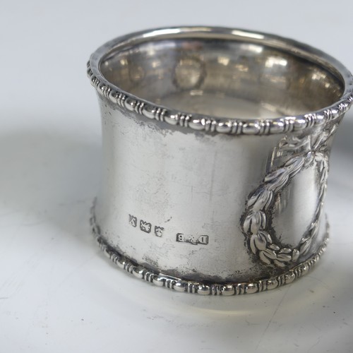 16 - A pair of George V silver Napkin Rings, hallmarked Birmingham 1923, with vacant laurel wreath cartou... 