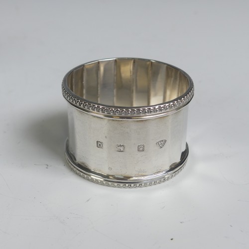 16 - A pair of George V silver Napkin Rings, hallmarked Birmingham 1923, with vacant laurel wreath cartou... 